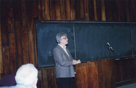 Photograph of an unidentified woman giving a speech at Charles Armour's retirement party