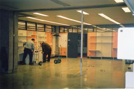 Photograph of men working on then2001 renovation the Killam reference room