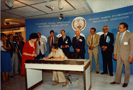 Photograph of Elisabeth Mann Borgese signing a document