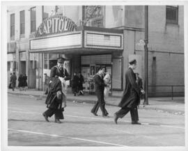 Photograph of sailors carrying looted goods past the Capitol Theatre on Barrington Street during ...