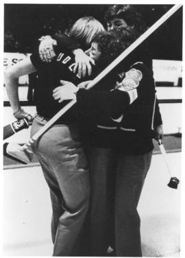 Photograph of Penny LaRocque and three other unidentified curlers hugging
