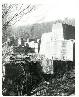Photograph of the concrete foundation for an ore crusher at the Molega mines