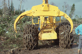Photograph of a grapple yarder at a clearcutting site near Corner Brook, Newfoundland