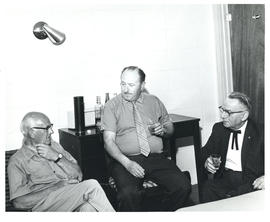 Photograph of Thomas Head Raddall, Larry Boner, and G. Cecil Day sharing a drink at Brooklyn, Nov...
