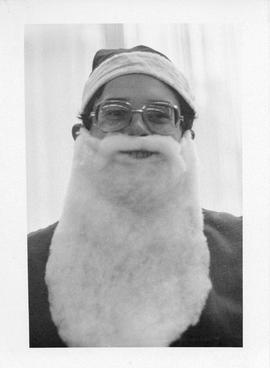 Photograph of David Briggs wearing a Santa beard