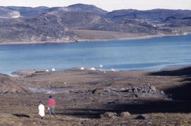 Photograph of two people walking at Tellik Inlet, Northwest Territories