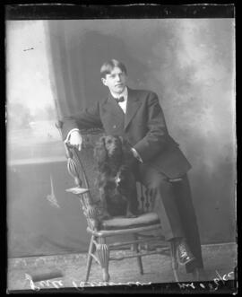 Photograph of Mr. Perle Bernasconi and a dog