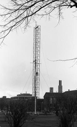 Photograph of a flag pole being repaired