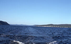 Photograph showing Postville, Newfoundland and Labrador from the middle of Kaipokok Bay