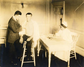 Photograph of a patient exam associated with the Massachusetts-Halifax Health Commission