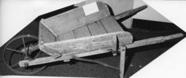 Photograph of a wooden wheelbarrow