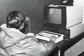 Photograph of a man using a computer
