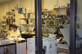 Photograph of staff working in the document delivery office at the Killam Memorial Library, Dalho...