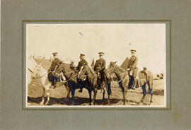 Photograph of four officers on horses