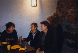 Photograph of Elisabeth Mann Borgese and two unidentified woman at a table