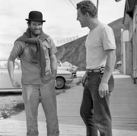 Photograph of two men standing on a sidewalk in Dawson City, Yukon