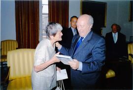 Photograph of Elisabeth Mann Borgese presenting President Guido de Marco with a copy of the "Ocea...