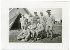 Photograph of nine Canadian Army Medical Corps staff in front of a tent
