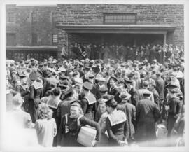 Photograph of crowds outside of Keith's Brewery on Lower Water Street during the Halifax VE-Day r...