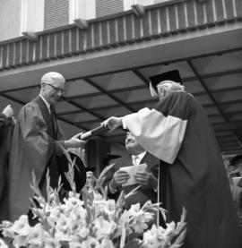 Photograph of Dr. C. J. W. Beckwith receiving an honorary degree