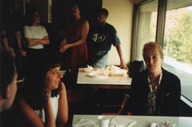 Photograph of unidentified guests at a group baby shower held in the staff room of the Killam Mem...