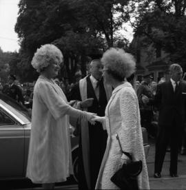 Photograph of an unidentified person greeting the Queen Mother