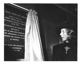 Photograph of Lady Beaverbrook with a plaque in honour of Sir James Dunn