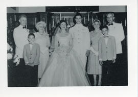 Portrait of Carol Cassidy's wedding, with the bride, groom, and their respective families