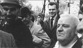 Photograph of unidentified men standing near active pro-war demonstrators at an anti-Vietnam war ...