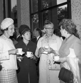 Photograph of four unidentified people with teacups