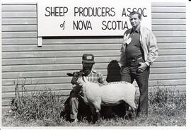 Photograph of Sheep Breeders Association of Nova Scotia's president Roy Evans, Lincoln Boswell an...