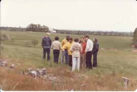 Photograph of a group of people standing in a field during the Sheep Breeders' Association of Nov...