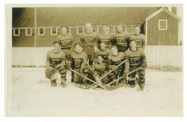 Photograph of the Nova Scotia Agricultural College hockey team on the ice, Roy MacDonald is the g...